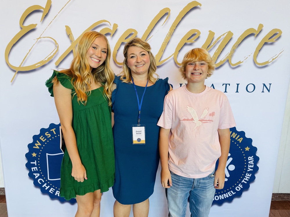 Mrs. Reed and her children at the Teacher of the Year Celebration